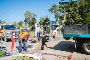 City workers marking utilities in preparation for trenchless sewer repair by Caccia team