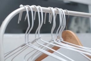 Wire coat hangers in bathroom as improvised tools for unclogging toilet