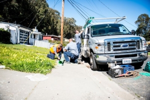 Caccia Home Services truck outside job site near end of trenchless sewer repair job