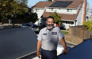 Anthony from Caccia Home Services smiles after installing new solar panels