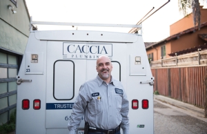 Angelo from Caccia Plumbing standing by his truck smiling, ready to help fix a Scala2 pump.