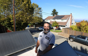 Anthony from Caccia Home Services smiles after finishing a solar panel install in San Mateo