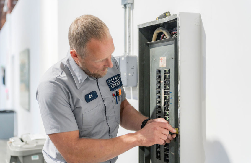 Ed from Caccia Home Services troubleshoots a customer's electrical panel