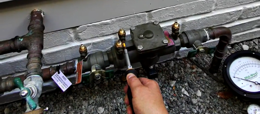 Photo: backflow preventer device with test tag