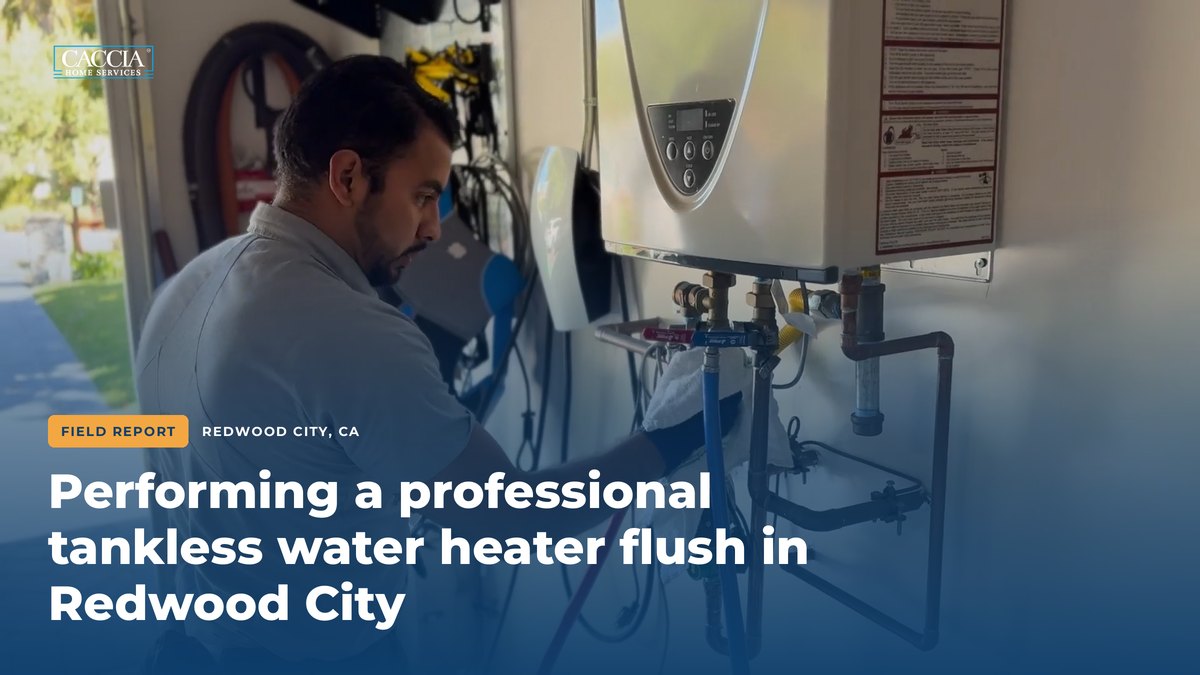 Performing a Professional Tankless Water Heater Flush 7 Caccia technician Cristian connecting hoses to the isolation valves of a tankless water heater, with the field report title