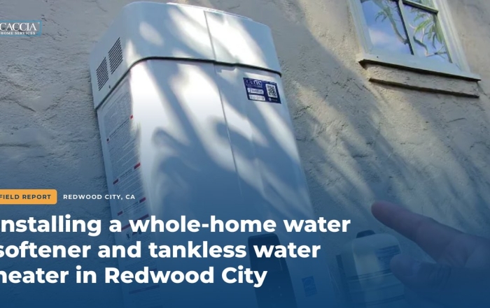 Navien tankless water heater on an exterior wall with the field report title for the Redwood City water softener and tankless water heater installation