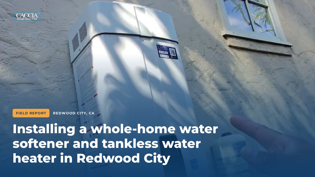 Navien tankless water heater on an exterior wall with the field report title for the Redwood City water softener and tankless water heater installation