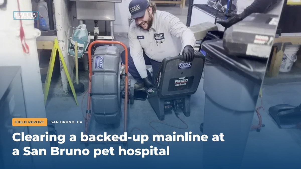 Caccia technician setting up a RIDGID camera and drum auger at a San Bruno pet hospital, with the field report title