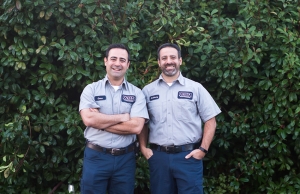 Geno and Anthony stand smiling in San Mateo