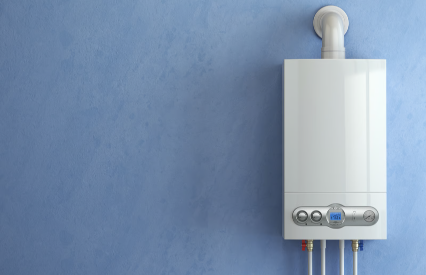 A tankless water heater with a small LED panel and chrome buttons mounted on a wall
