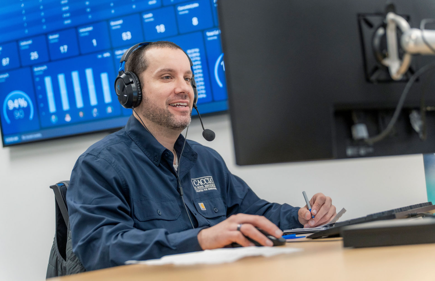 A customer service agent from Caccia Home Services talks to a customer on the phone