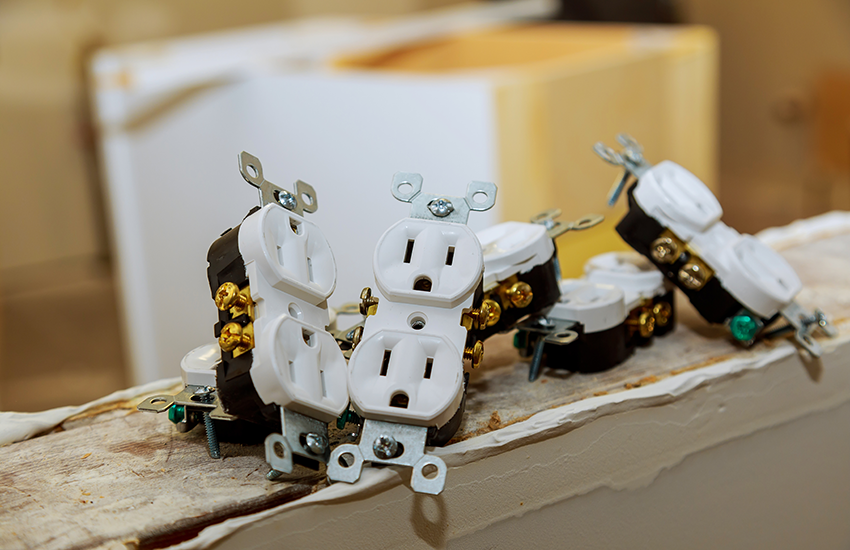 Electrical outlet components ready to be installed into a wall