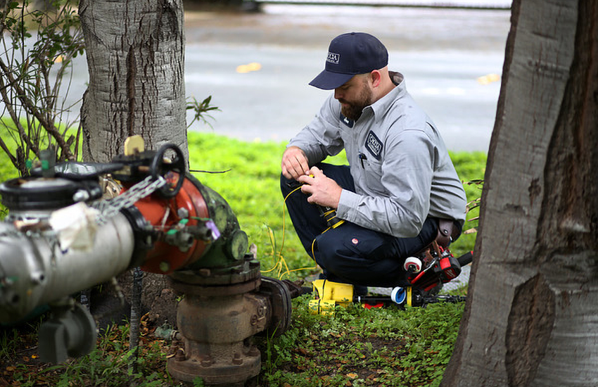A Caccia Home Services employee gets ready to check a customer's sewer line.
