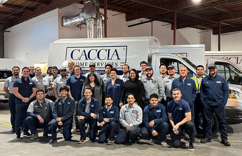 Caccia Home Service's team stands smiling for a group shot