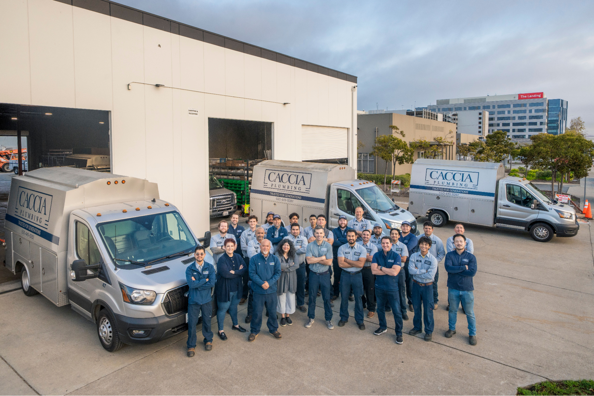 Caccia Home Services' employees smile for a picture on location.