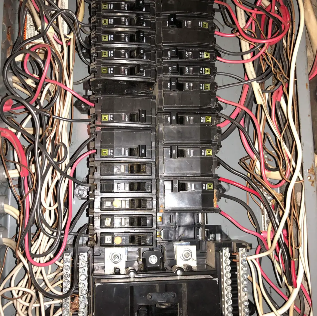 An old, outdated electrical panel.
