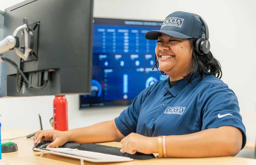 Residential EV Car Charger Guide for 2026 10 Veitoa from Caccia Home Services smiles at her desk