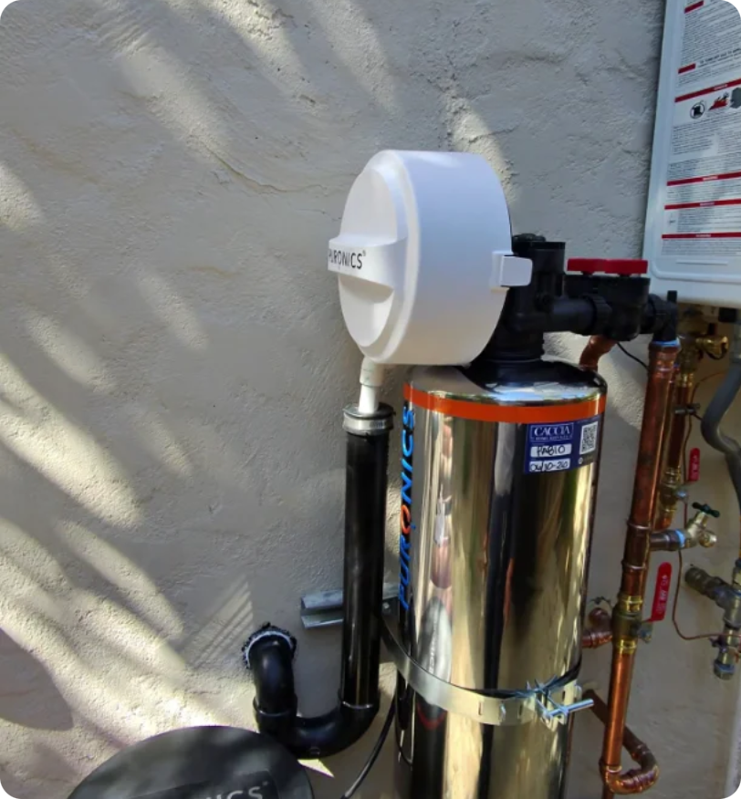 Caccia technician switching the Puronics iGen control valve into bypass before the initial backwash