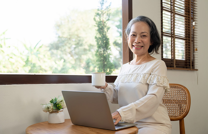Save $200 on Toilet Upgrades With This Rebate From SFPUC 8 A woman sips coffee while applying for a rebate on her laptop