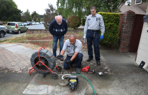 Moe from Caccia Home Services uses a camera to inspect a customer's sewer line.