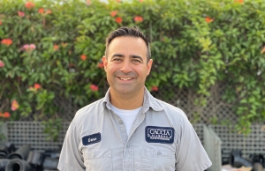 Photo of Geno Caccia smiling in customers backyard 