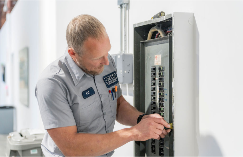 Ed from Caccia Home Services troubleshoots a customer's electrical panel