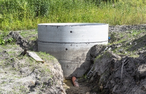 An older concrete septic tank with attached sewer line.