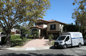 A branded Caccia Home Services van sitting in front of a San Mateo home.